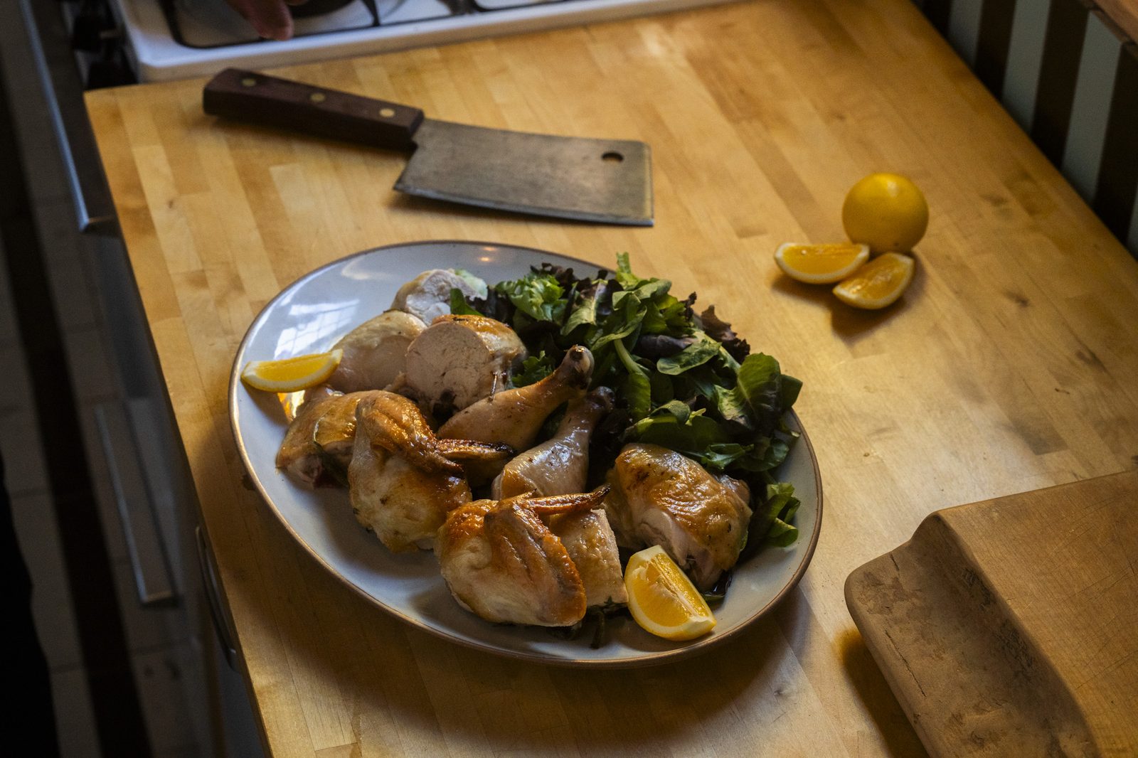 Herb-roasted chicken with mixed greens and lemon