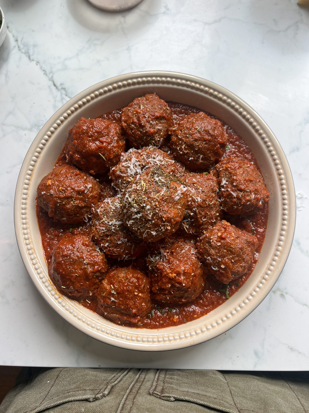 Meatballs in tomato sauce with shaved parmesan