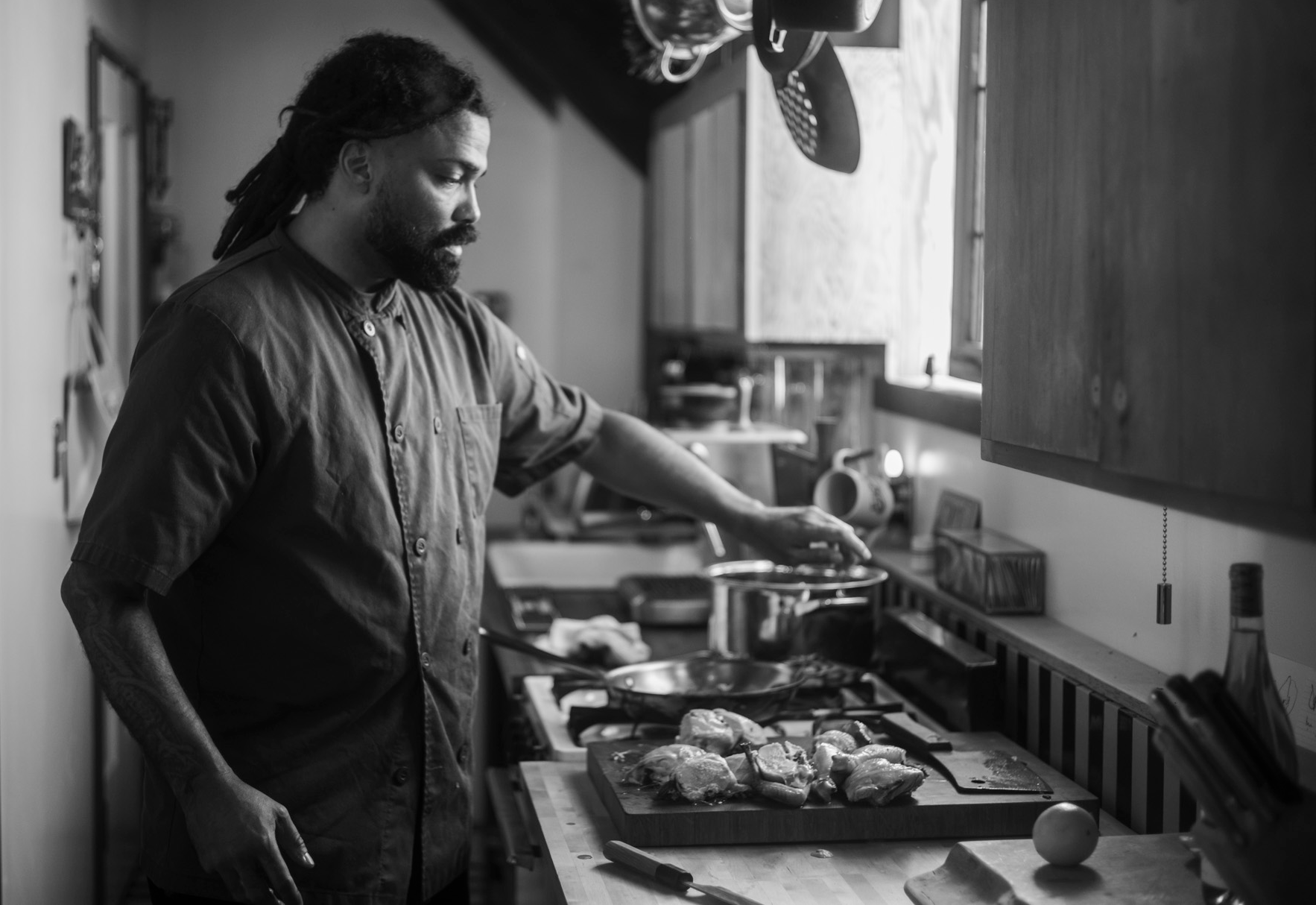 Chef Manny preparing a dish in the kitchen